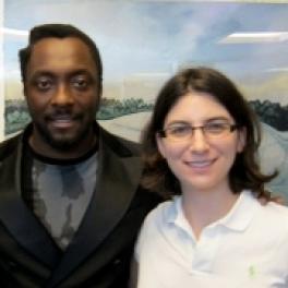 Dr. Anne Henochowitz (front) with will.i.am of the music group Black-Eyed Peas (back).
