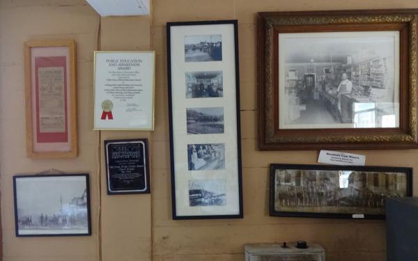 Photos and awards on the wall of the Little Cities of Black Diamonds office in Shawnee, Ohio