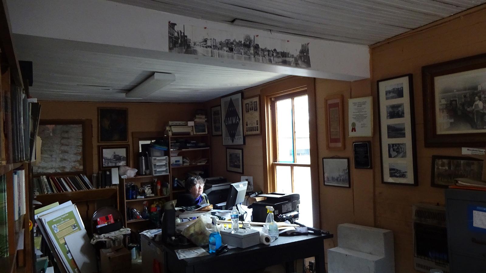 Cheryl Blosser pictured at her desk in the Little Cities of Black Diamonds Council Office