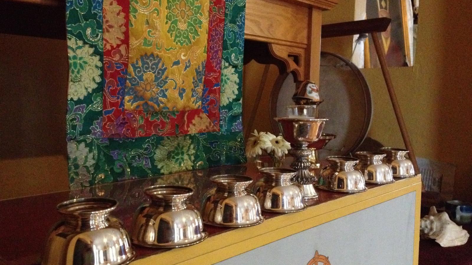 Silver bowls used for offerings at the Columbus Karma Thegsum Chöling Center
