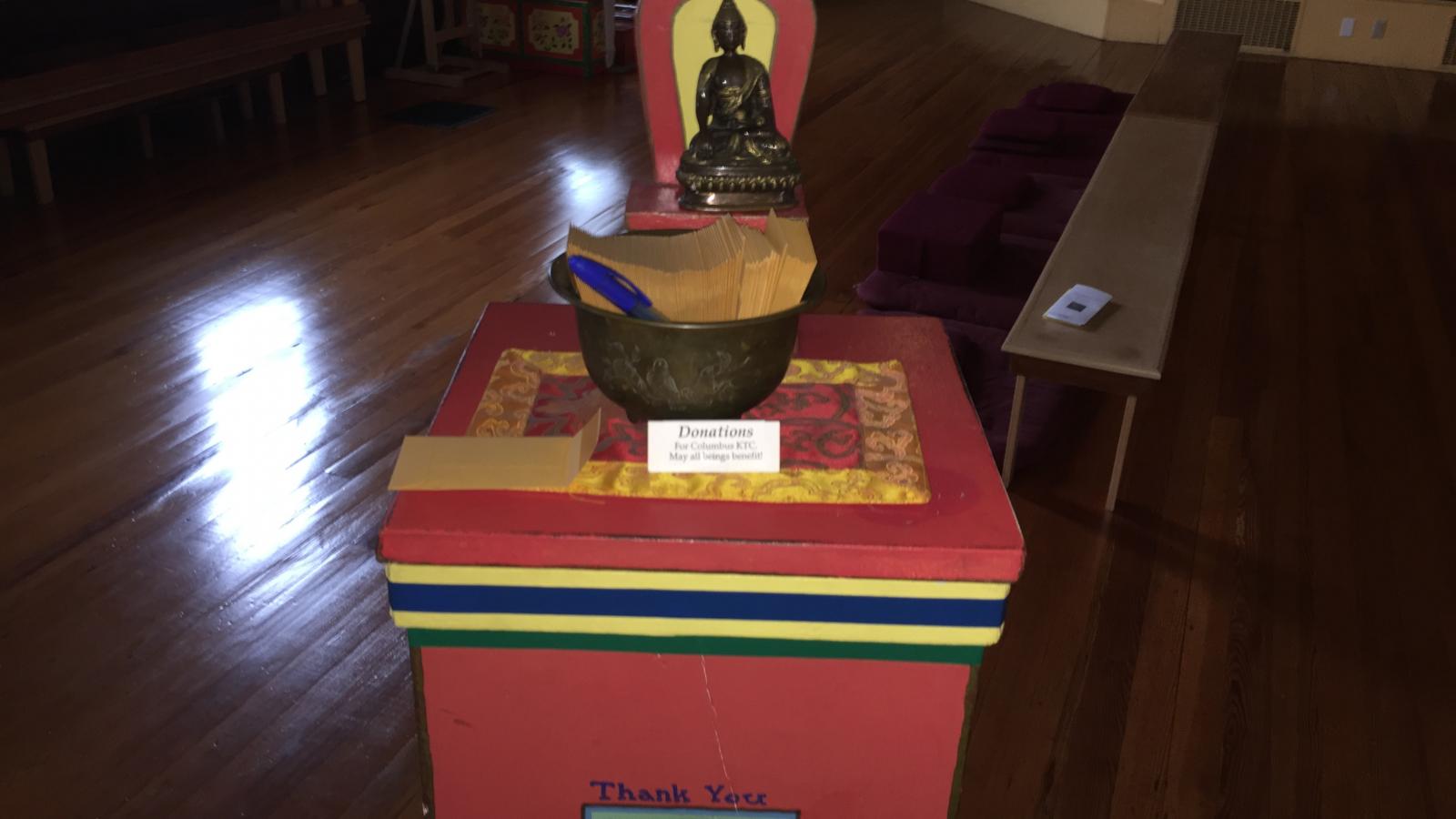 Donation box for the Karma Thegsum Choling Meditation Center