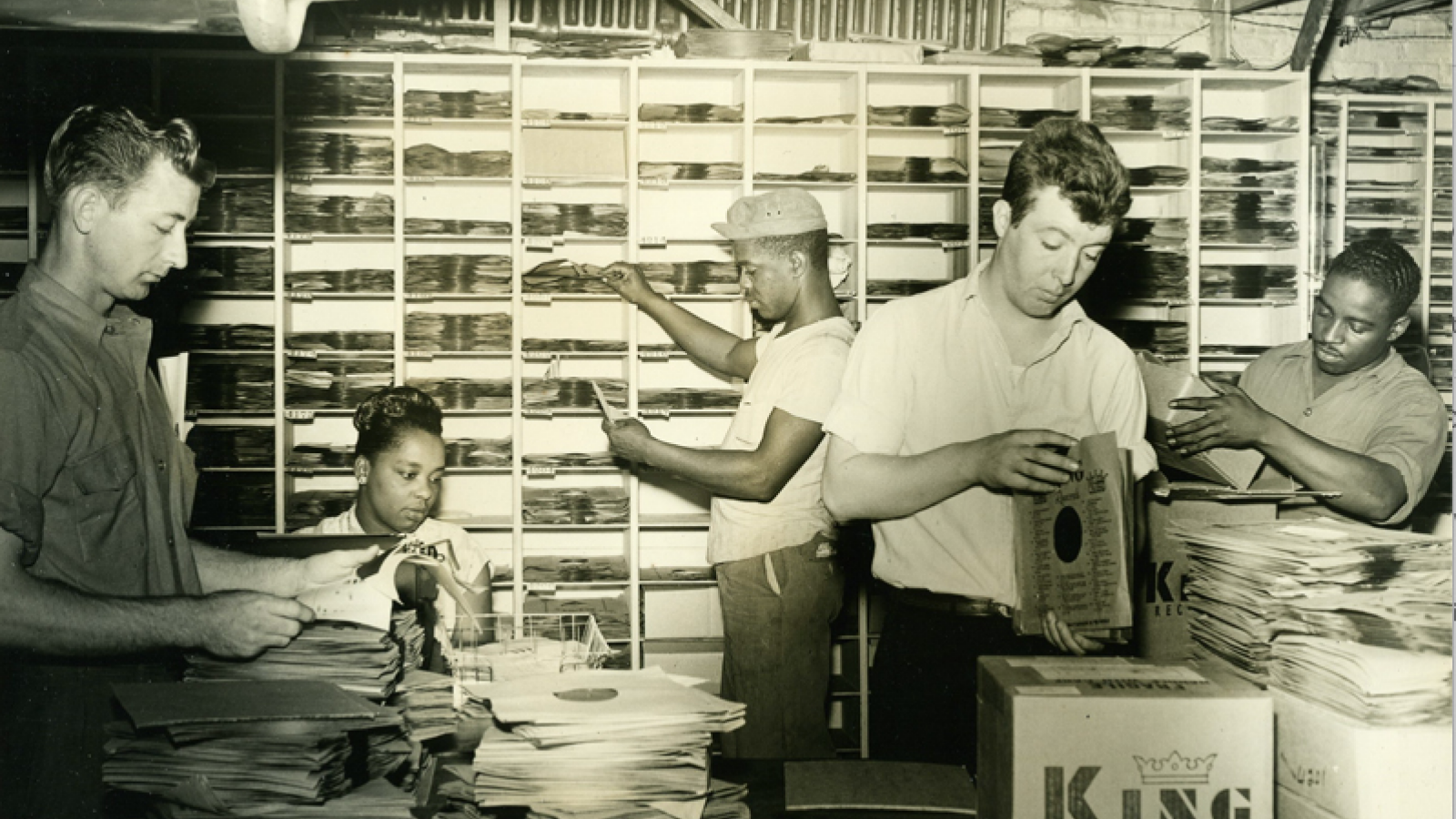 Five King Records employees sorting records
