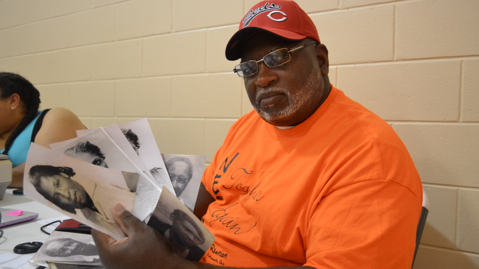 Roderick Wilson scans his family photographs at the North End Super Reunion, July 2017.