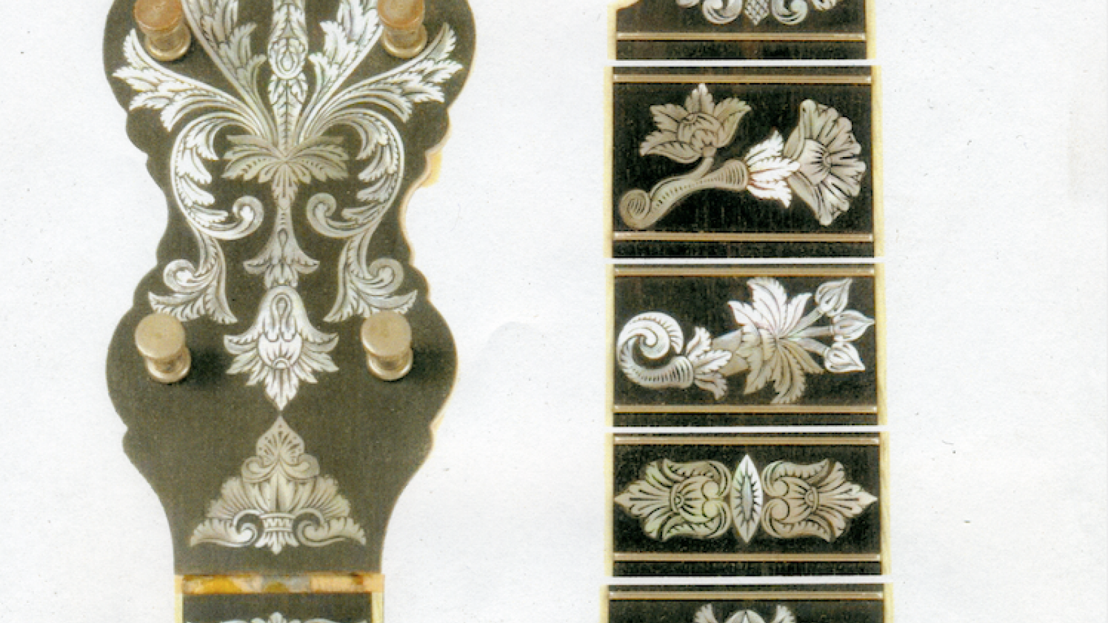 Engravings on the neck of a banjo