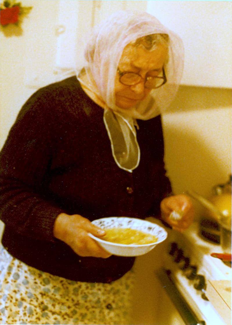 Mrs. Resnik takes bowls of borscht to the table