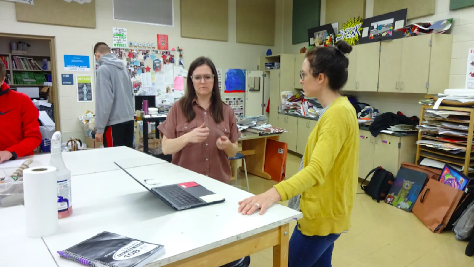 April Deacon and Kelly Babcock discussing the next steps for one of the art projects.