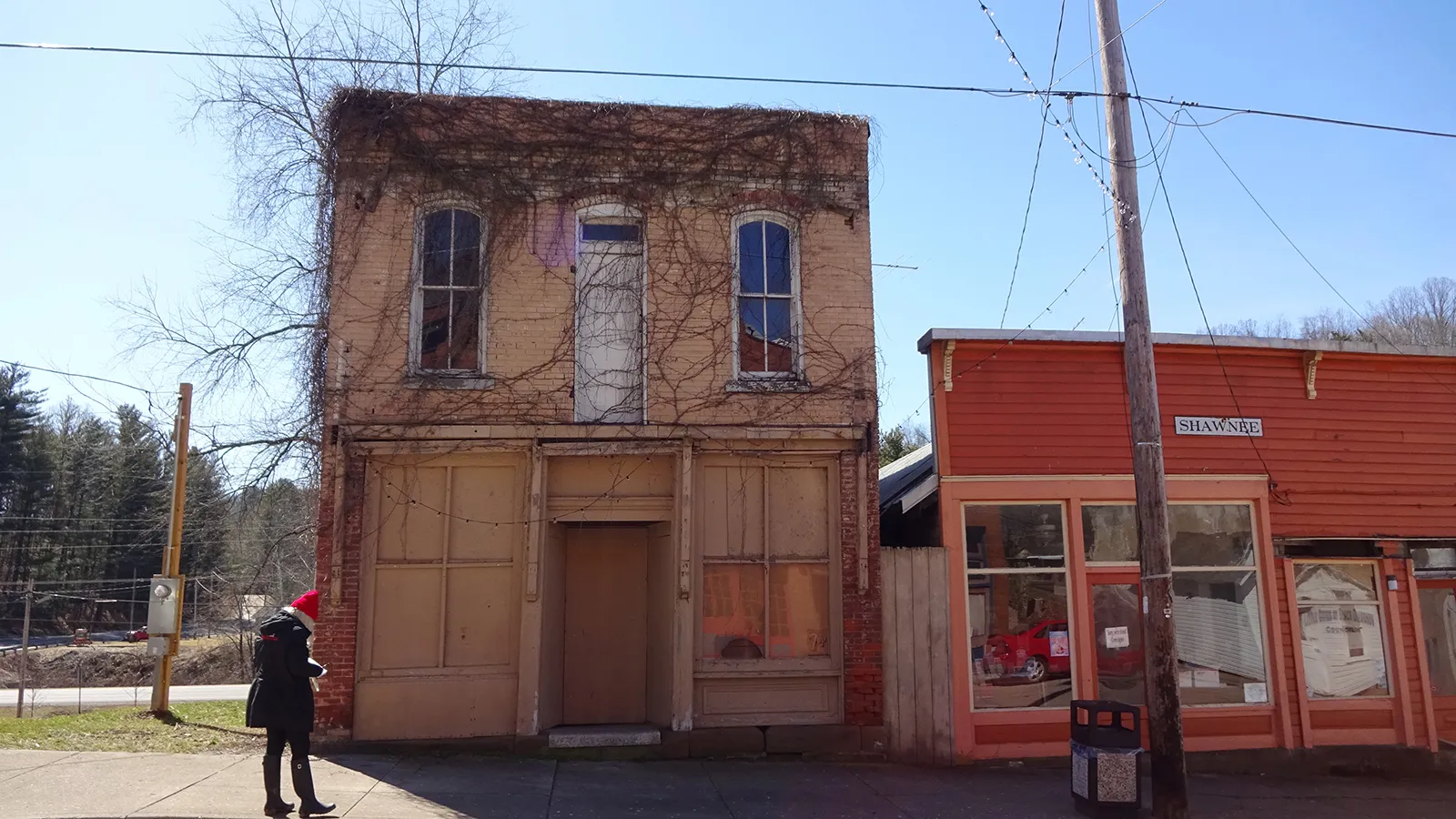 Isabelle Lambert pictured close to the Little Cities of Black Diamonds Council Office (orange building) on Main Street Shawnee