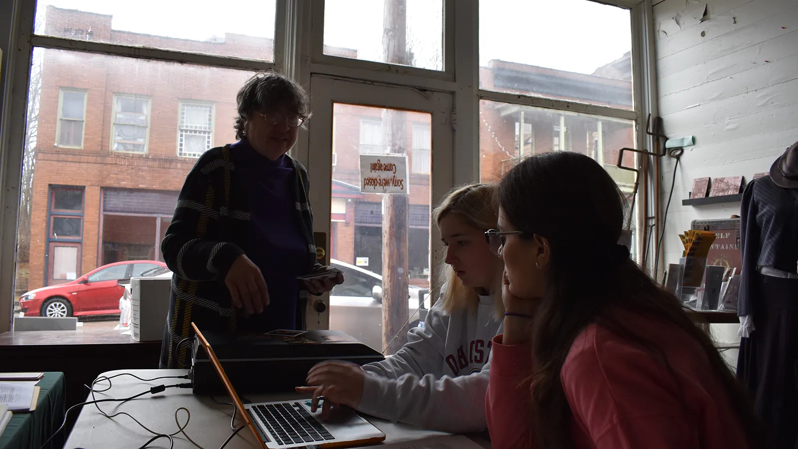Cheryl Blosser (left) pictured in the Little Cities of Black Diamonds Office with Isabelle Lambert (middle) and Paola Enriquez Duque (right)