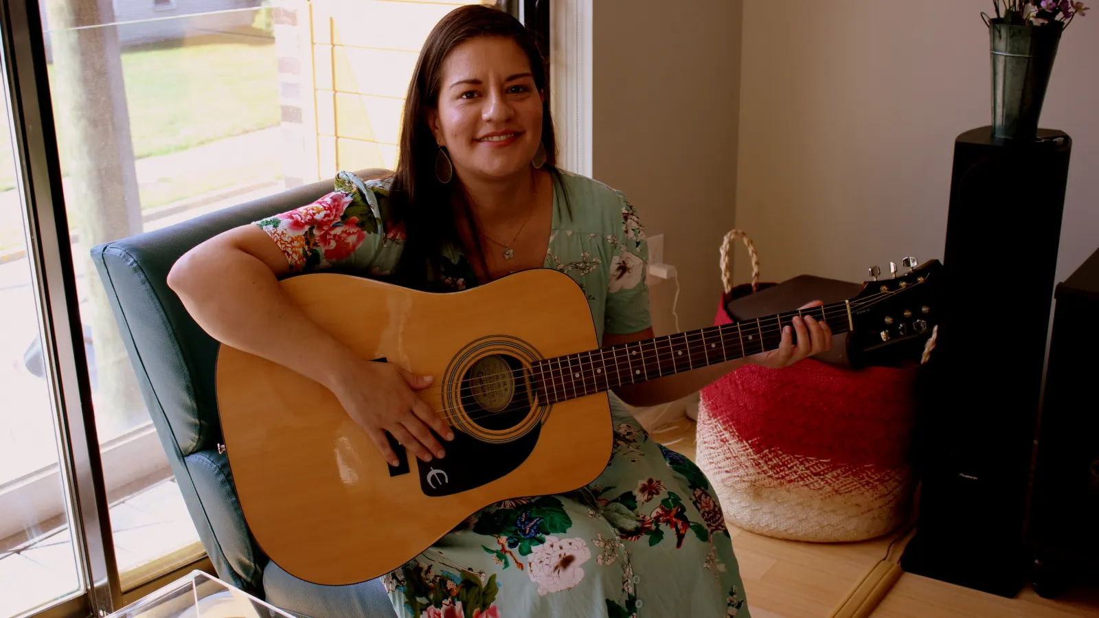 Camila playing her guitar
