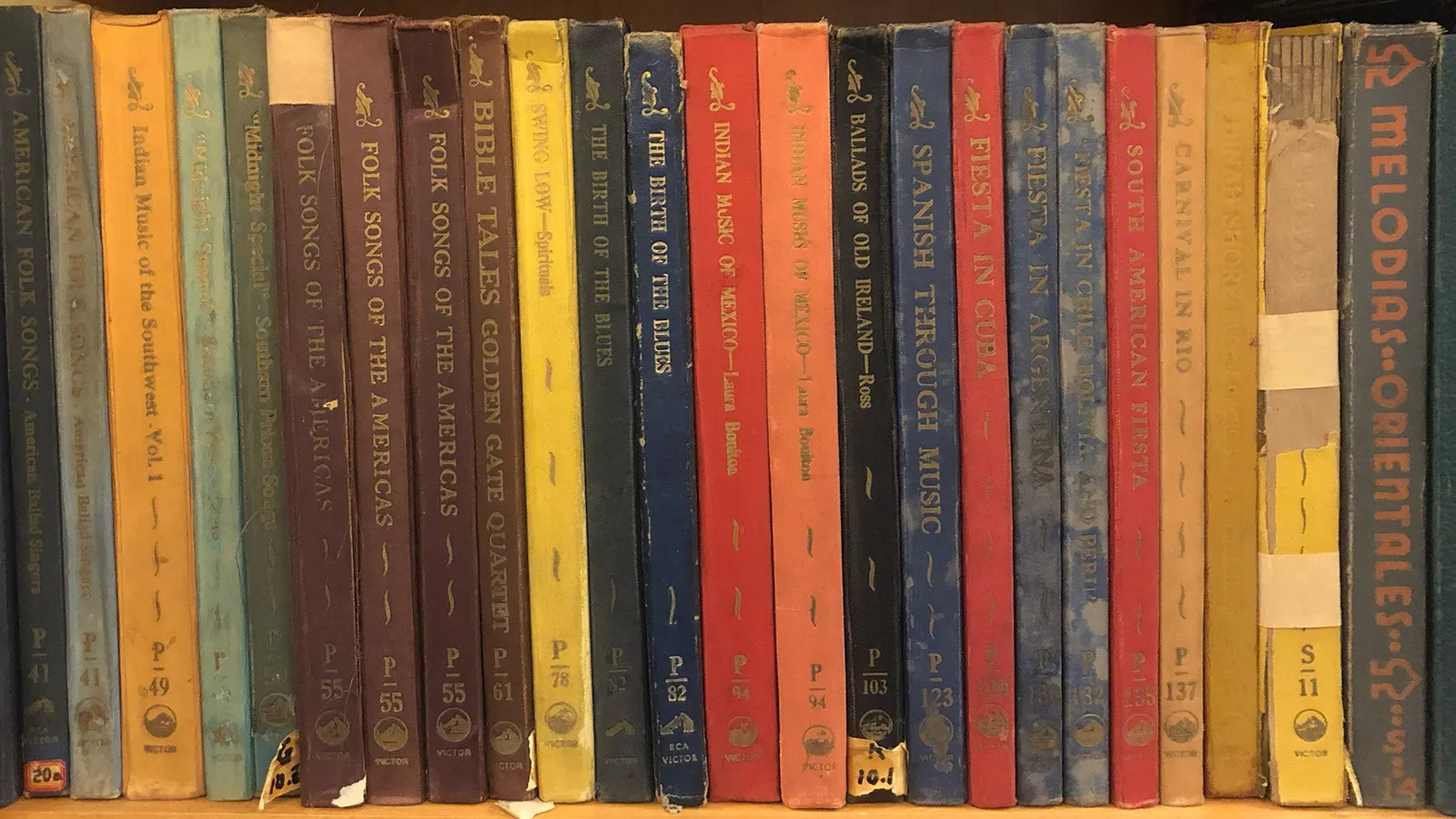 Spines of 78rpm Acetate Records on a shelf that were produced by Victor Records