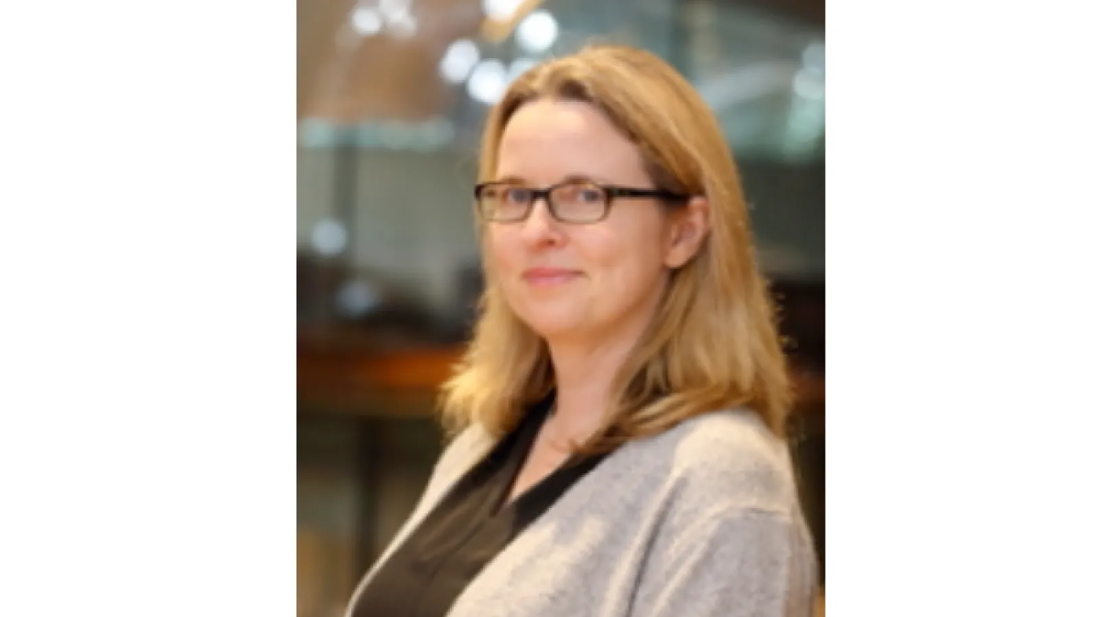 Headshot of Alison Fish, she has shoulder length blonde hair and brown glasses. 