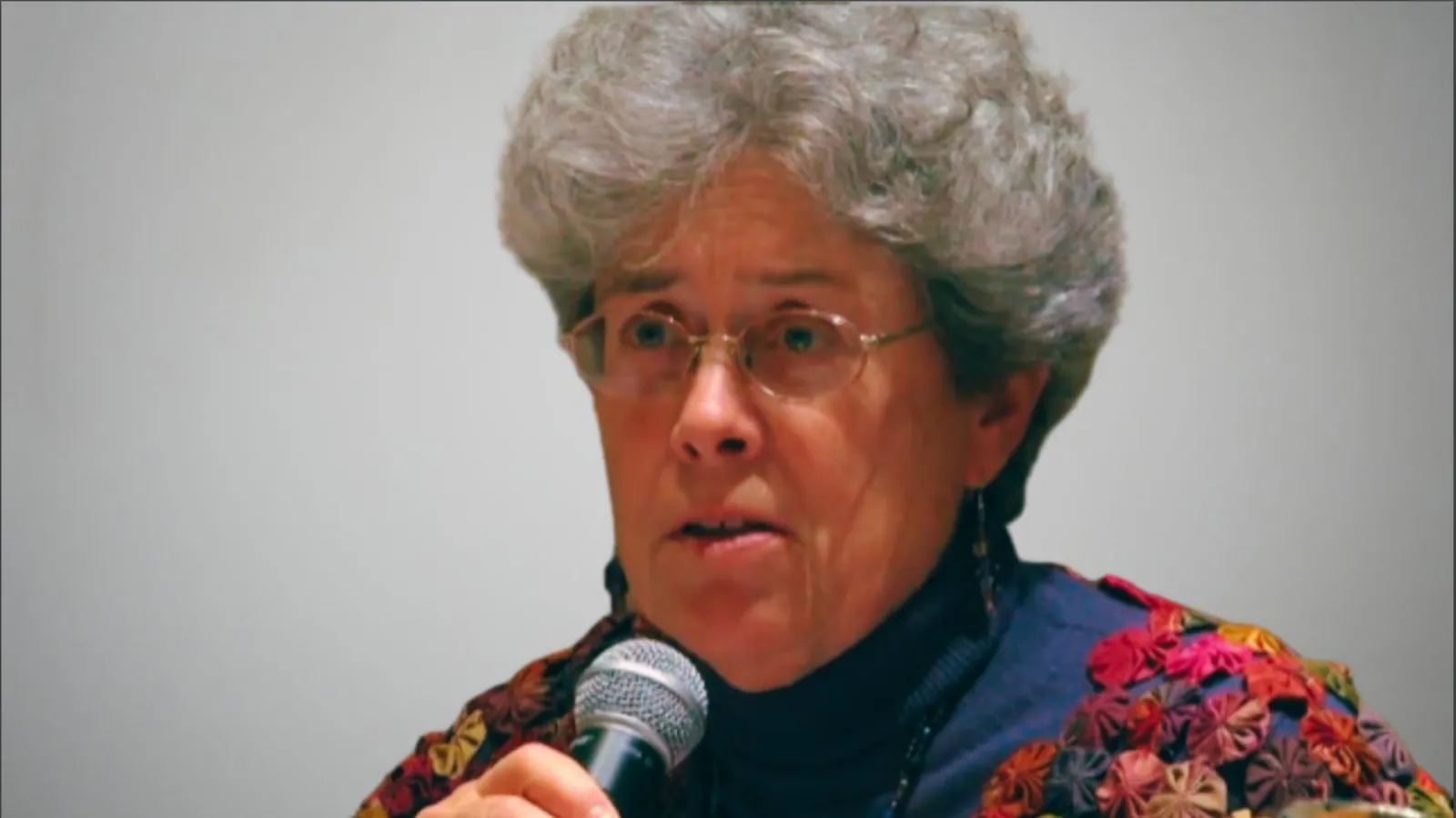 Margaret Mills with microphone