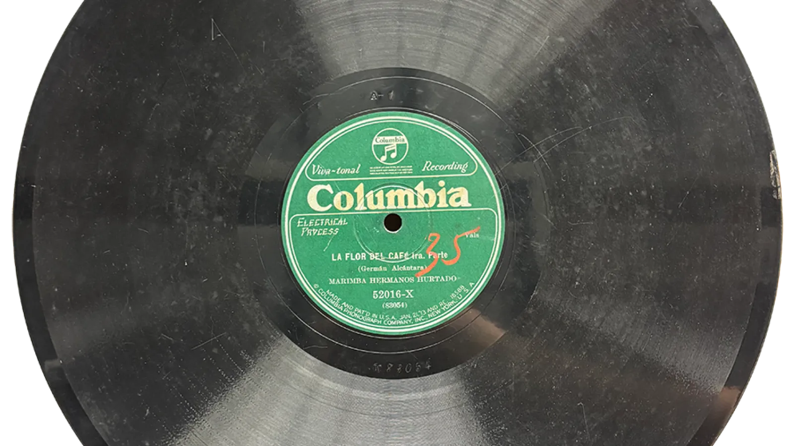 Vinyl record with text that says "La Flor Del Cafe - Marimba Hermanos Hertado"