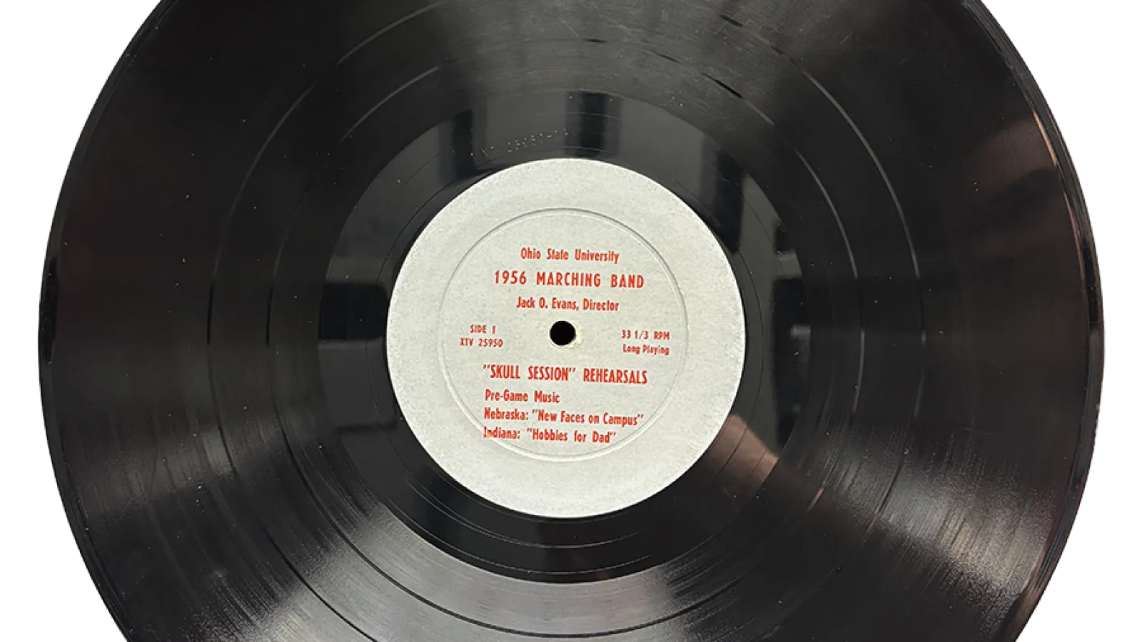 A vinyl record with text that says "The Ohio State University 1956 Marching Band (Jack O Evans, dir), Skull Session Rehearsals"