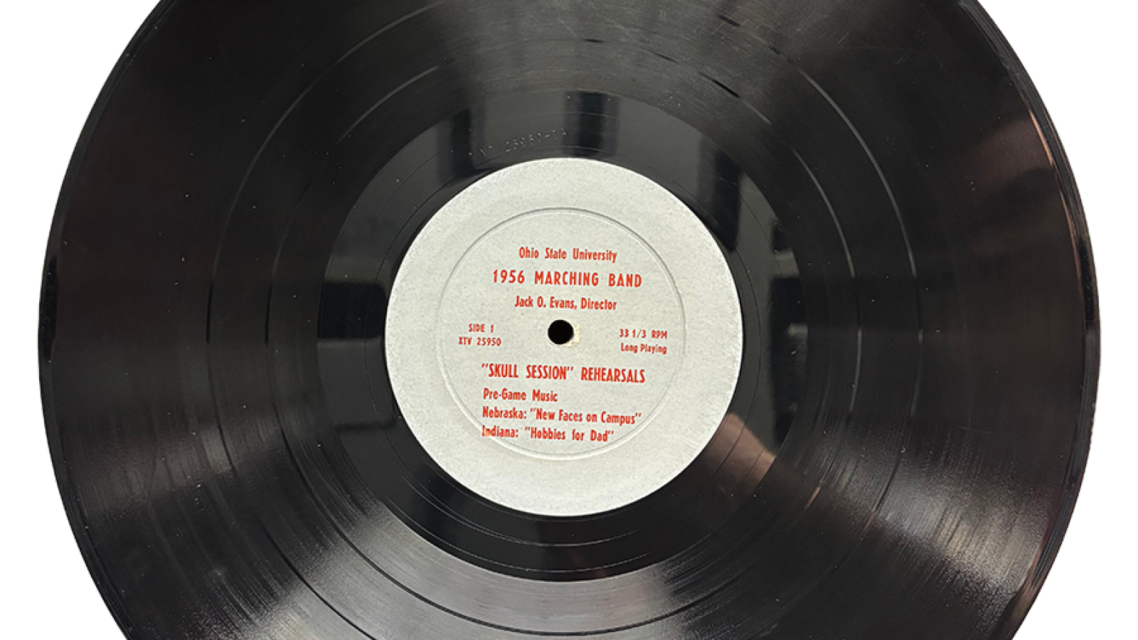 A vinyl record with text that says "The Ohio State University 1956 Marching Band (Jack O Evans, dir), Skull Session Rehearsals"