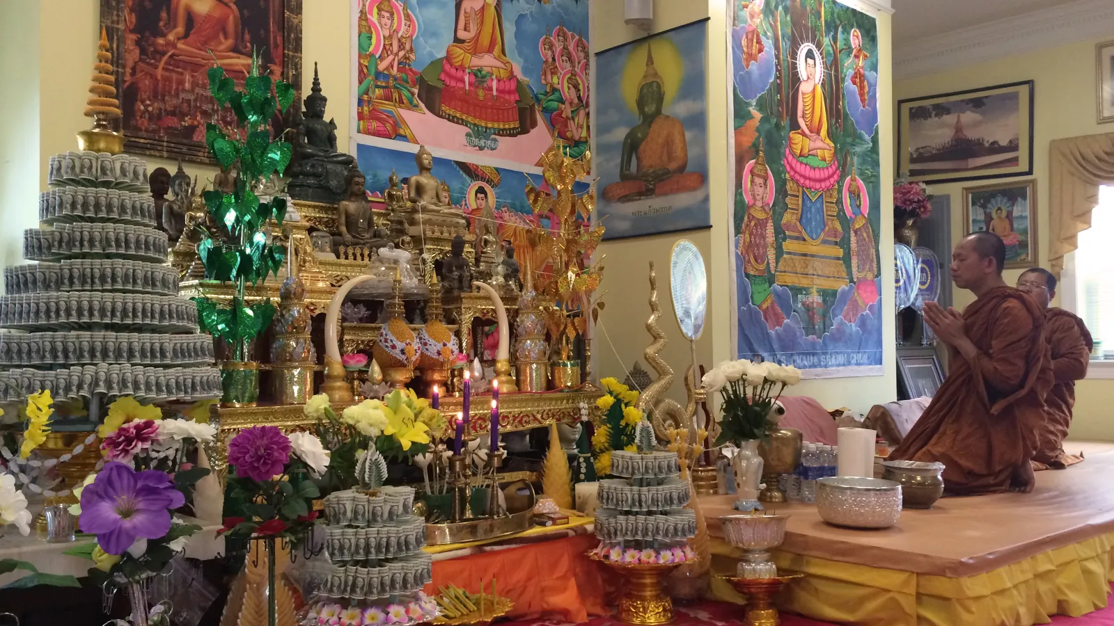The monks of Wat Buddhasamakidham lead the Wednesday evening chanting and meditation on the platform altar. 