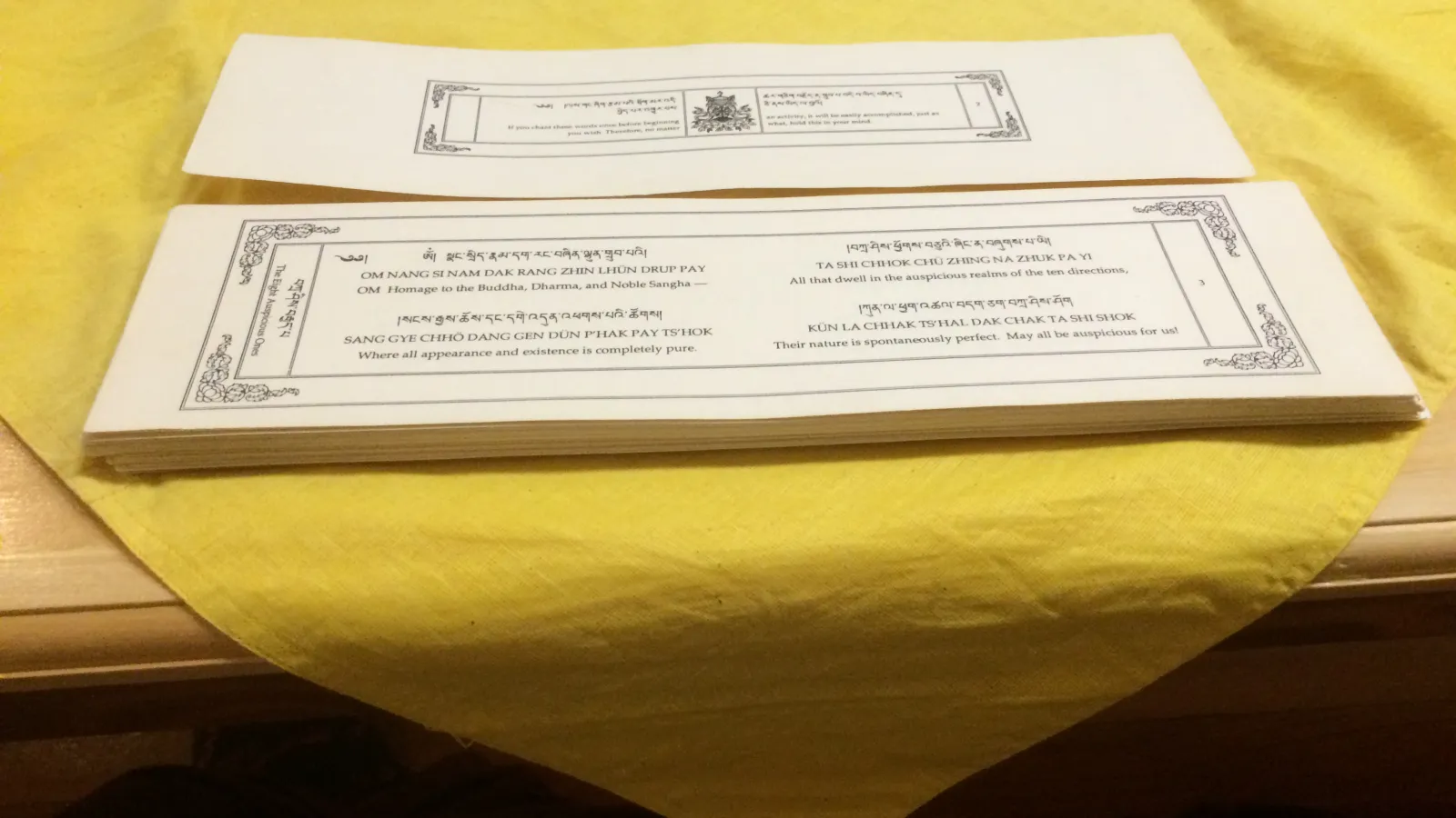 Cards with the chants and prayers transcribed at the Columbus Karma Thegsum Chöling Center