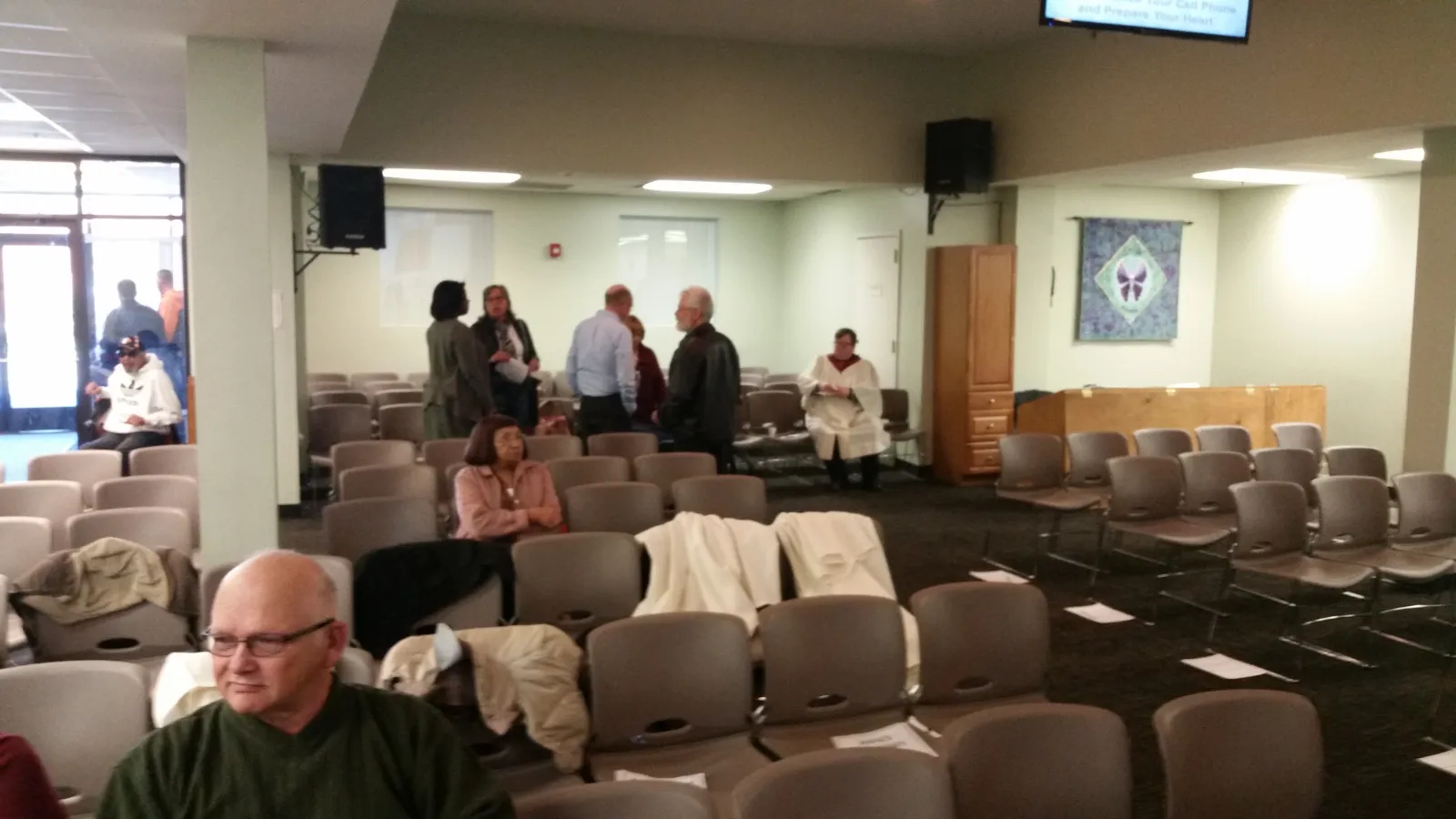 Waiting for service to begin at Church for All People