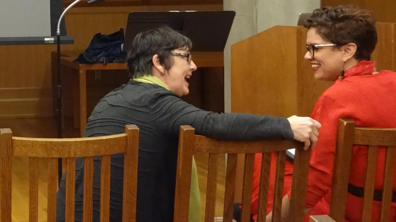 Katherine Borland and Crystal Good talking after the event. The two women are laughing. 