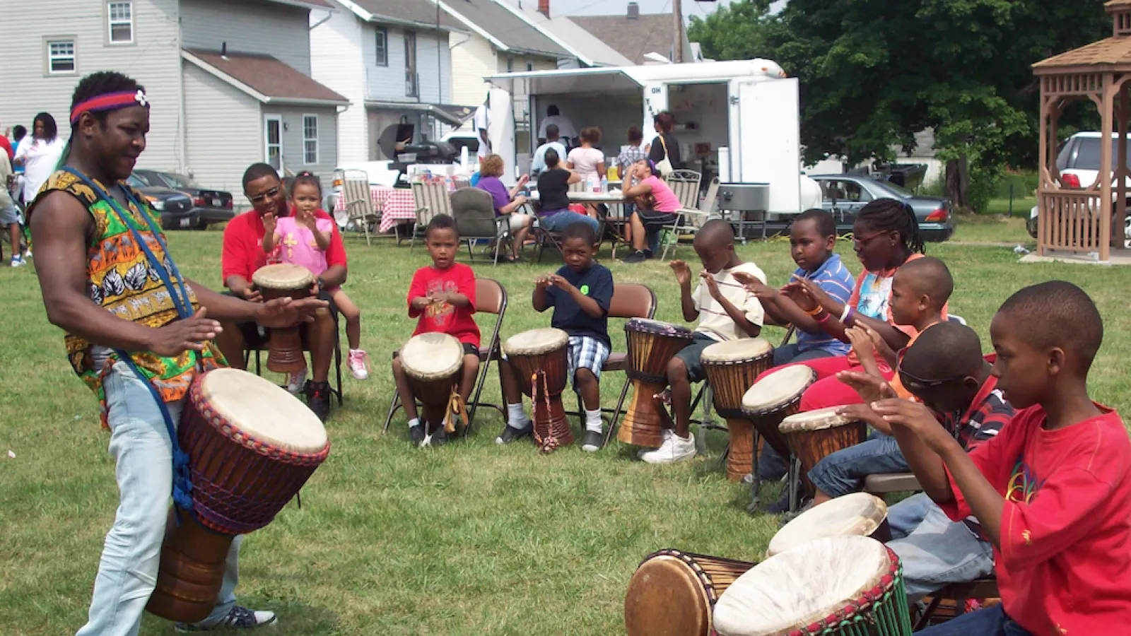 Diomande performing outside for children