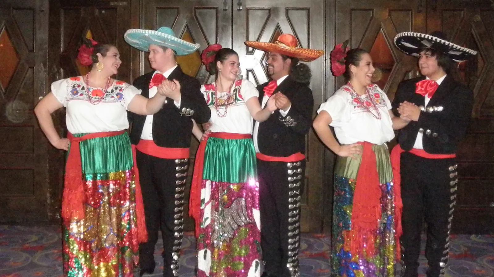 three couples dancing in costume