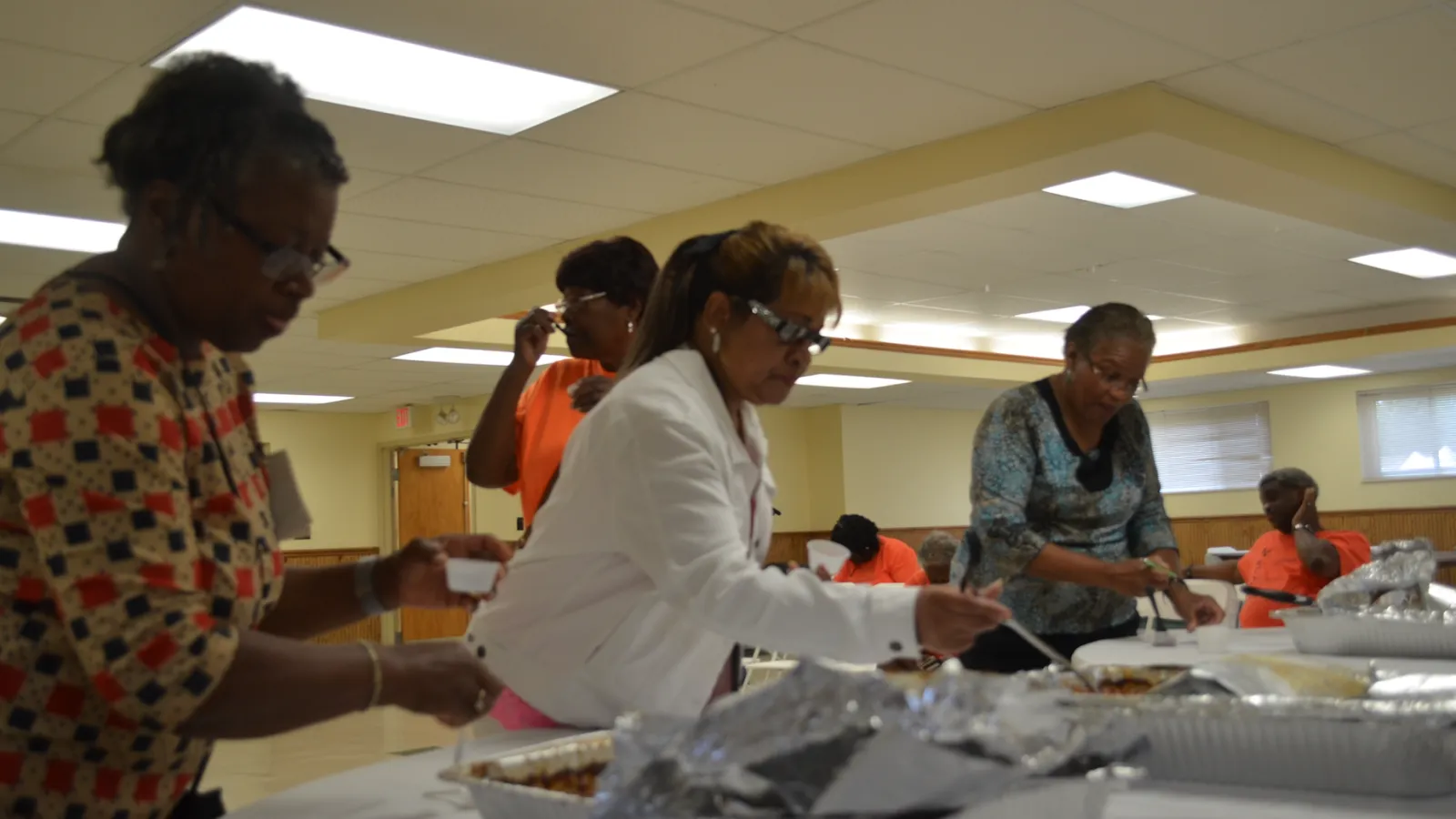 Judges taste entries for the Baked Bean Cook-off.