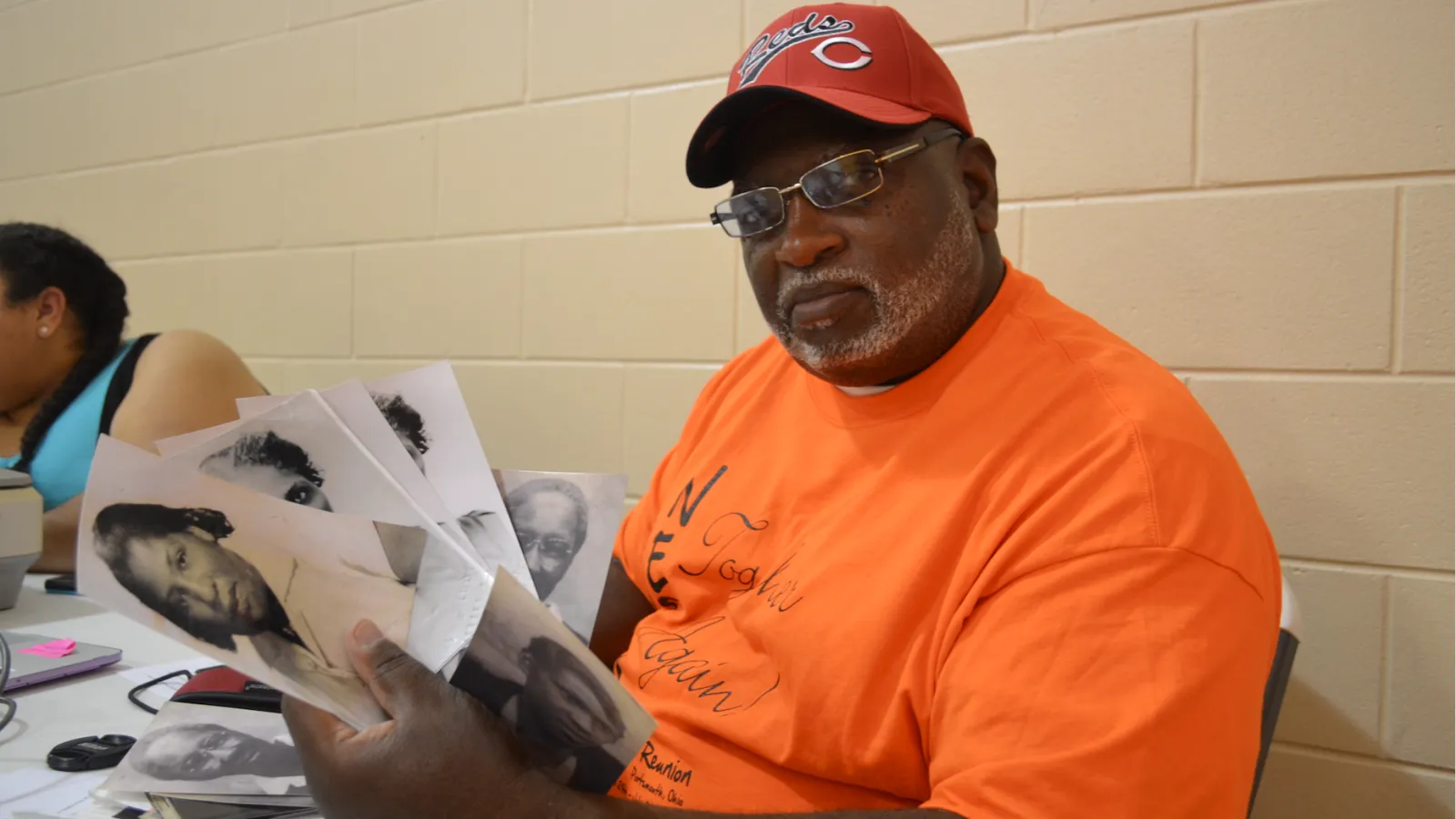 Roderick Wilson digitizes his family photos at the archive booth.