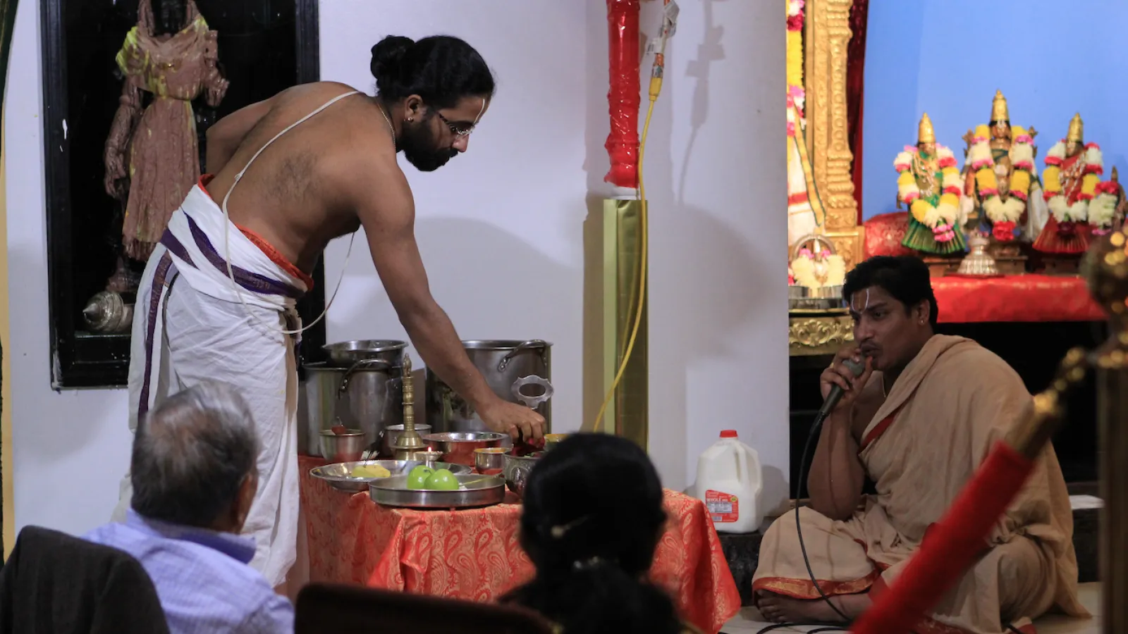 Priests chant and perform a service for the festival of Diwali