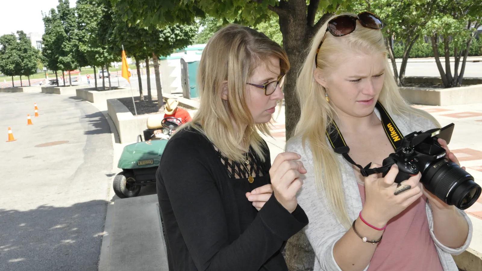Krista Bryson assists Brooke Walters with camera logistics