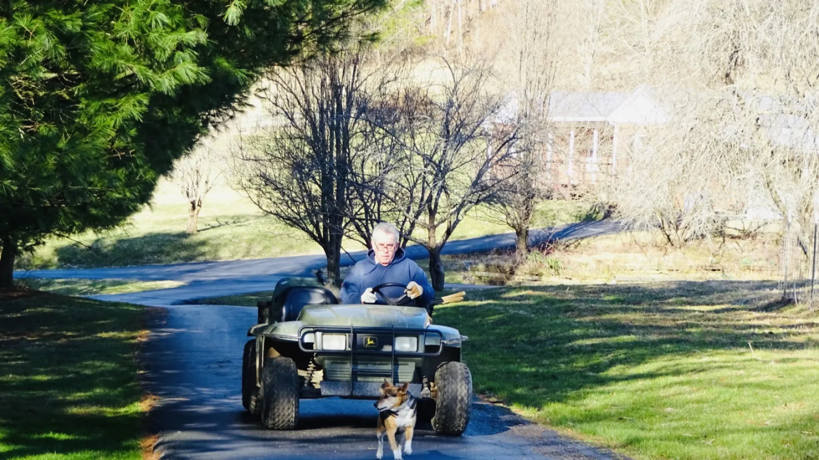 Man driving small farm equipment