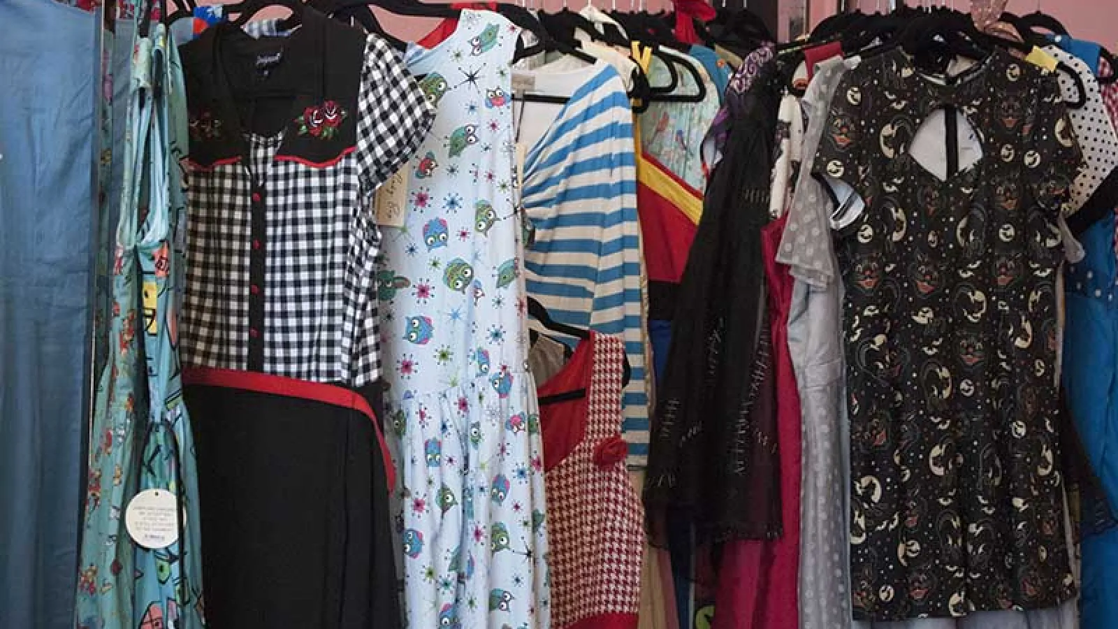 row of dresses on hangers