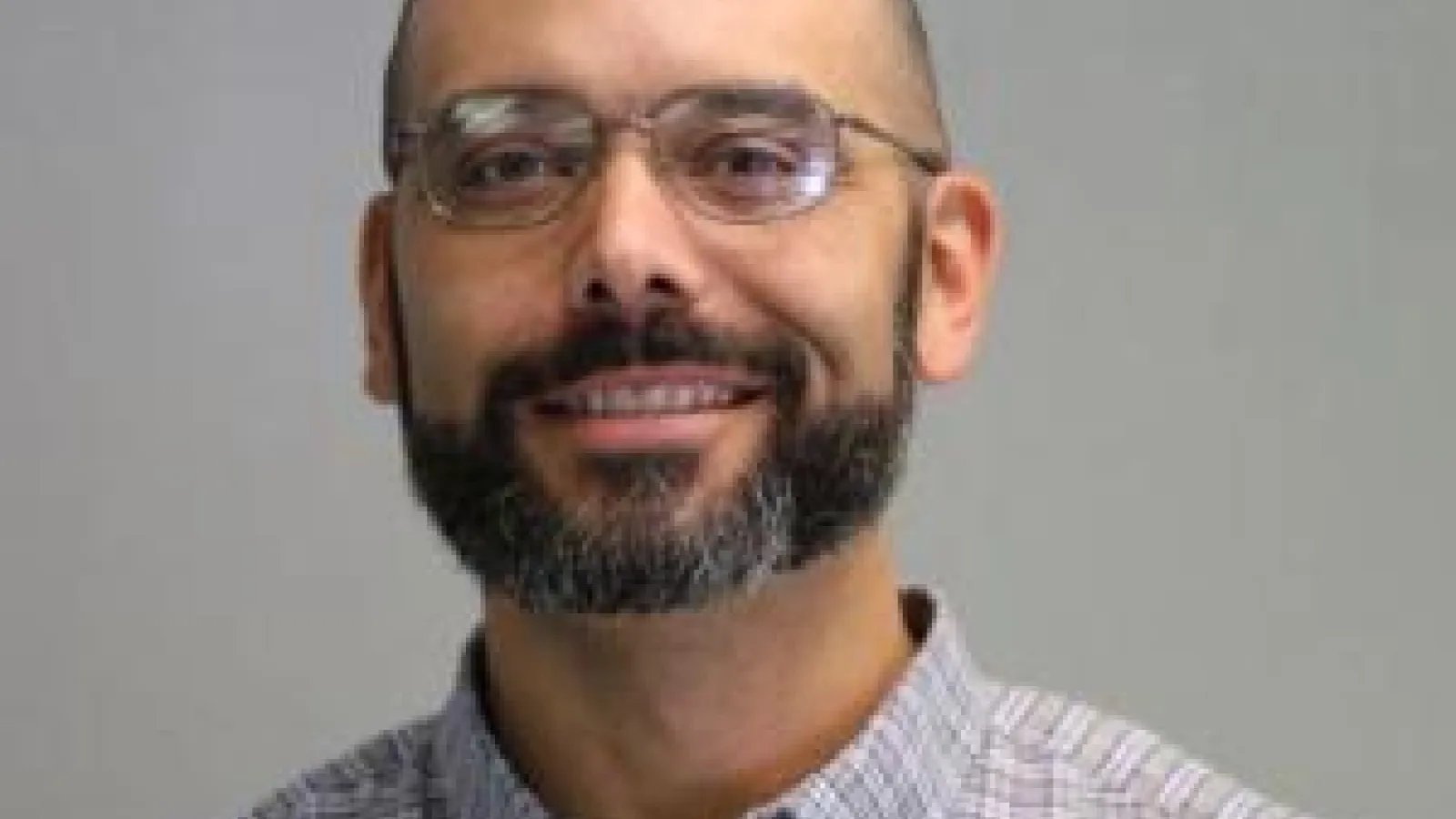 Headshot of William Isom II.