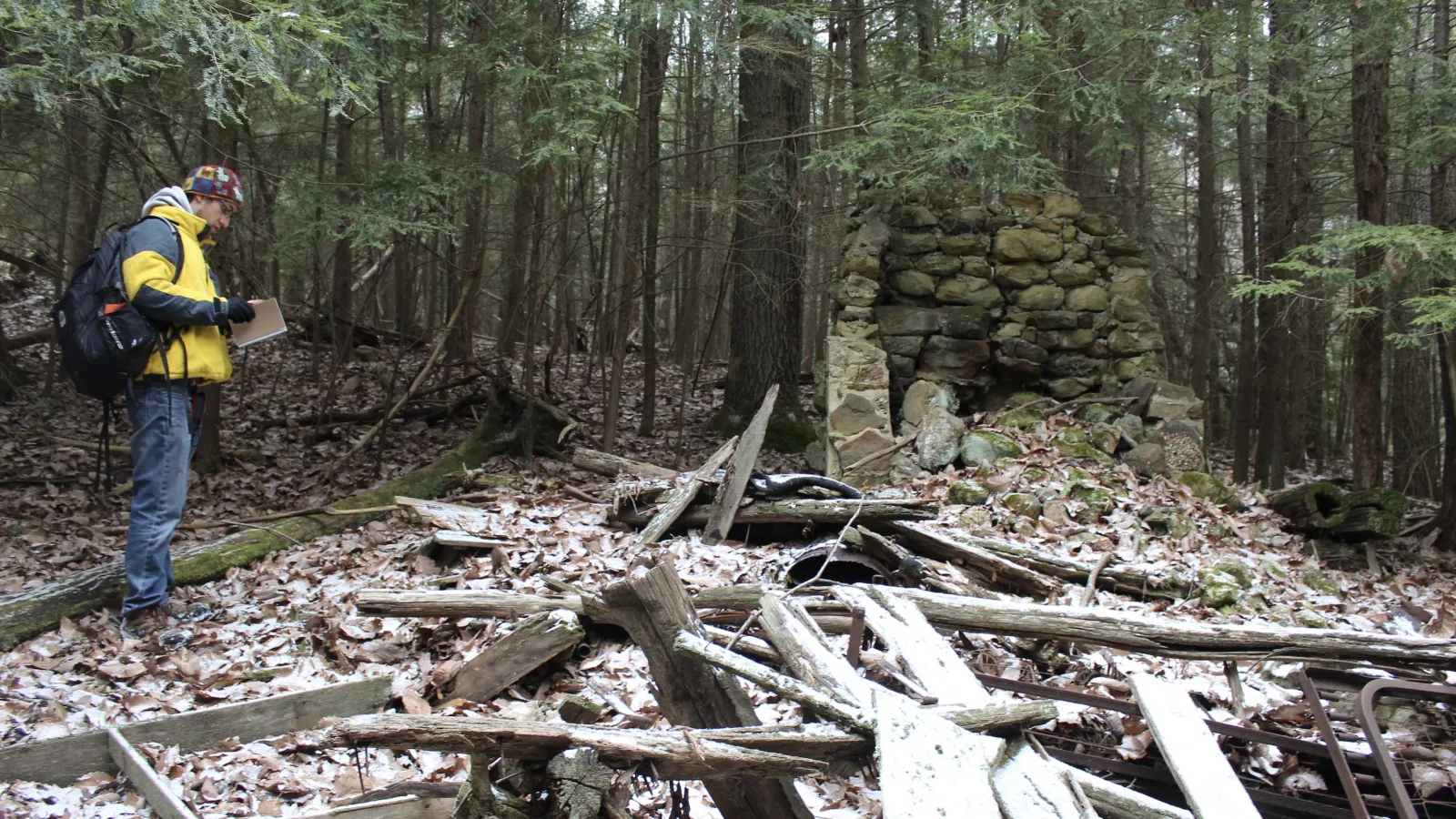 Frankie Isabelle III stands before the ruins of "liar's lodge" at Lake Katharine State Nature Preserve.