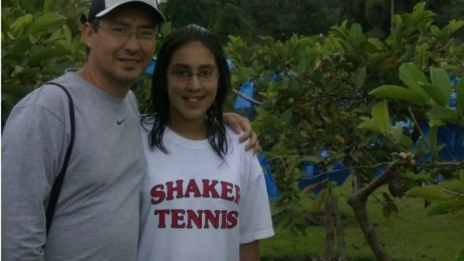 Young Laura with her father in Colombia