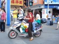 Man and woman on motor bike.