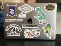 Photo by Jason Blum of Jake's computer which displays many stickers