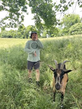 hris Chmiel and his goat Mocha Latte, practicing qi gong on Integration Acres land.