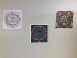 Motivational quote printouts hanging on the wall
