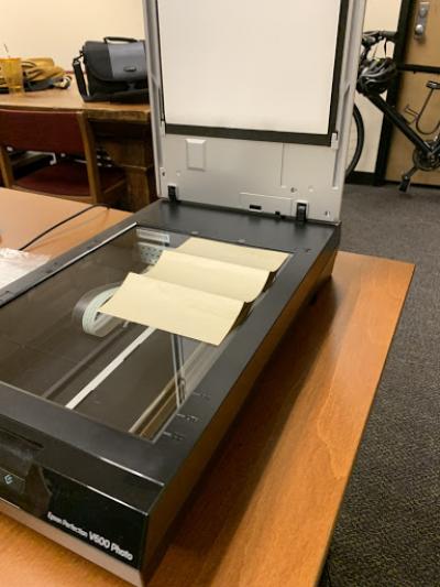 One of the tender letters being scanned on a flatbed scanner at the Folklore Archives.