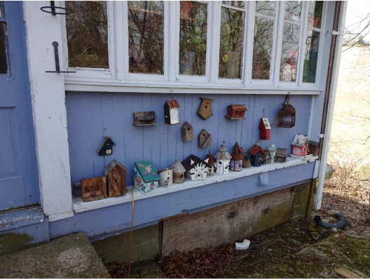 Birdhouses lined along Hariagle Garage porch