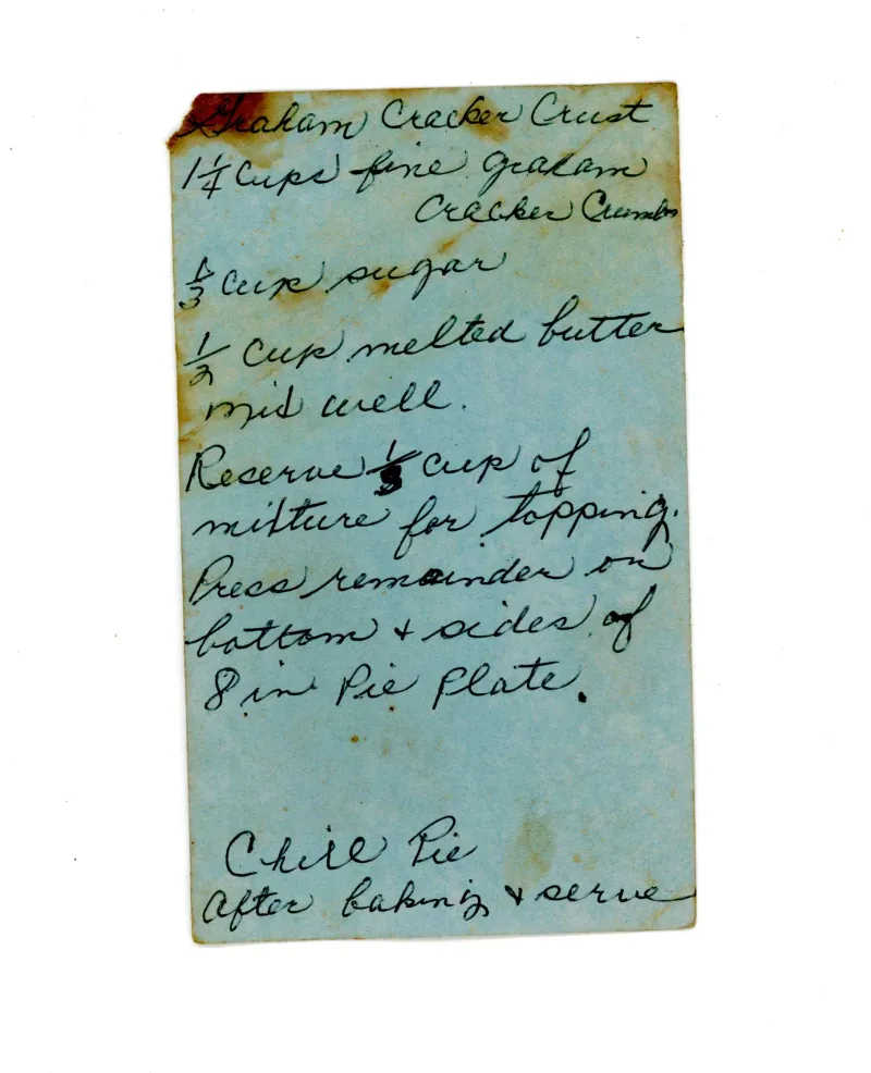 a blue piece of paper with illegible handwriting on it