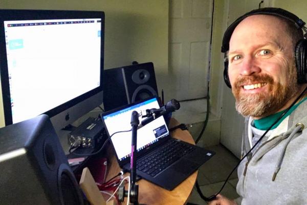 John Fenn podcasting from his home