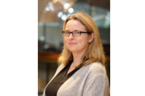 Headshot of Alison Fish, she has shoulder length blonde hair and brown glasses. 