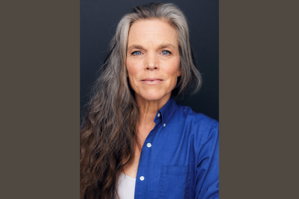 a portrait of a woman with long grey hair she is not smiling