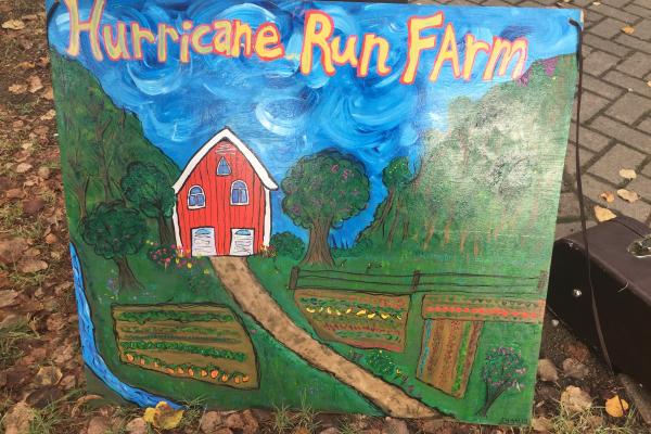 Hurricane Run Farm sign at farmers market