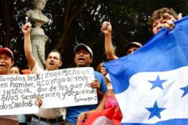 Human Rights Protesters in Honduras carrying Honduras' flag