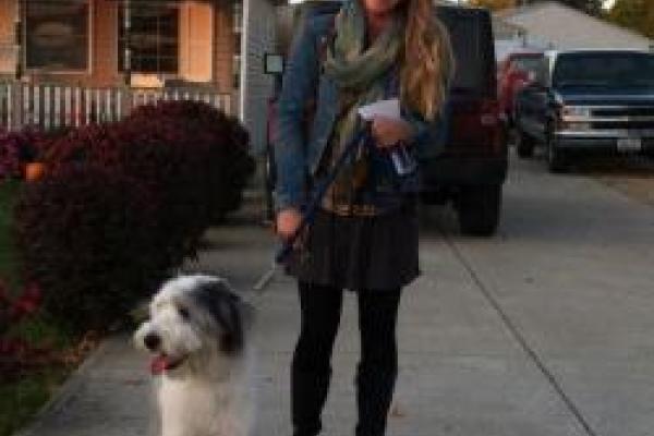 Kaitlyn Berle Kaitlyn Berle standing with a sheep dog