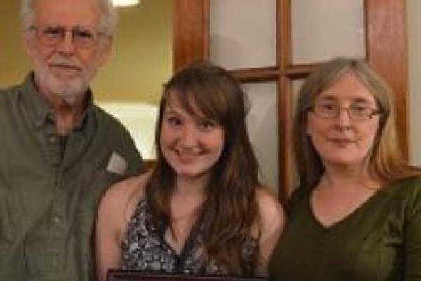 Mullen and Barnes Prize Winner Female student displaying award