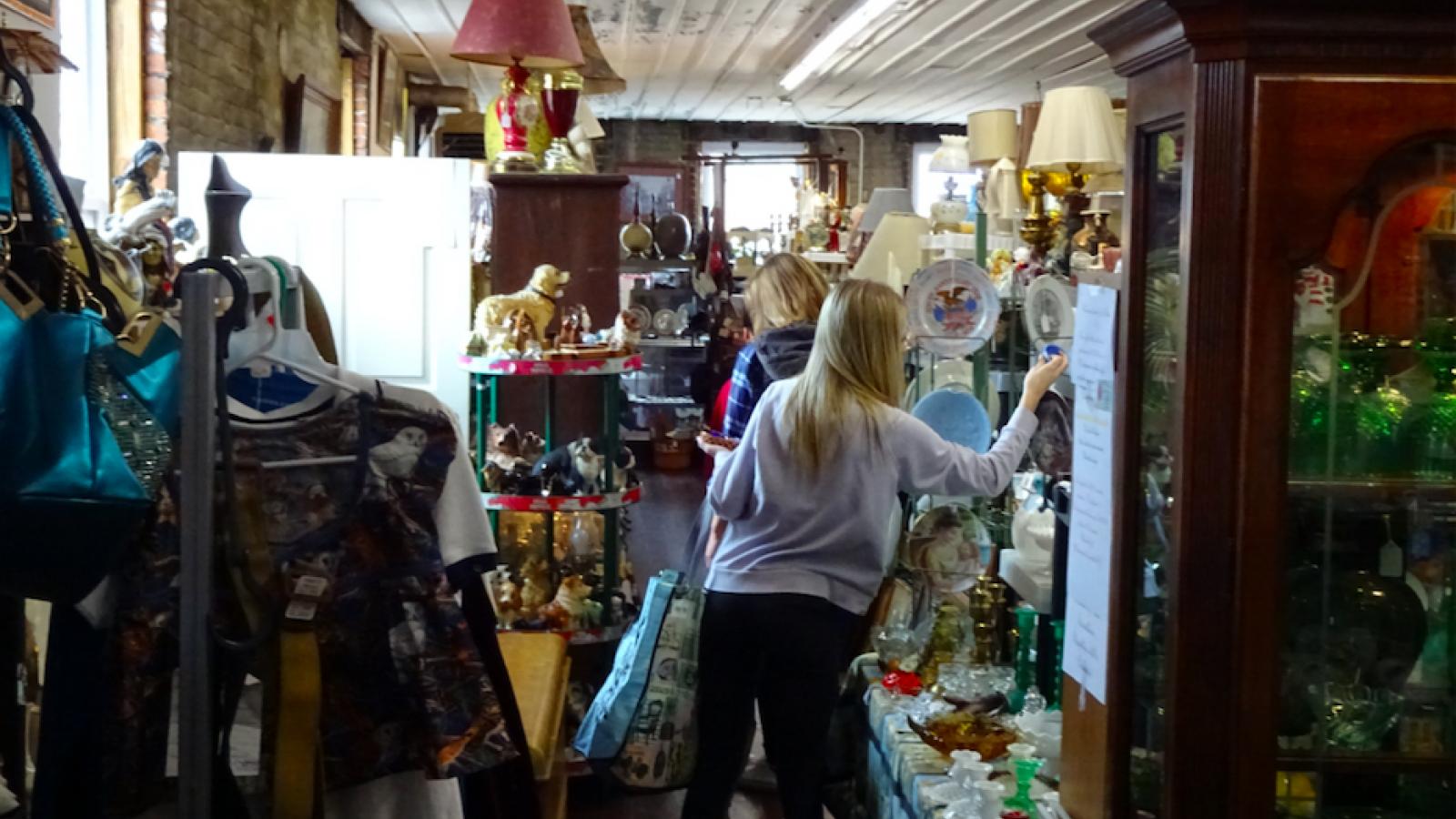 Students shopping for antiques and found objects at Ghosts in the Attic Antique Mall.