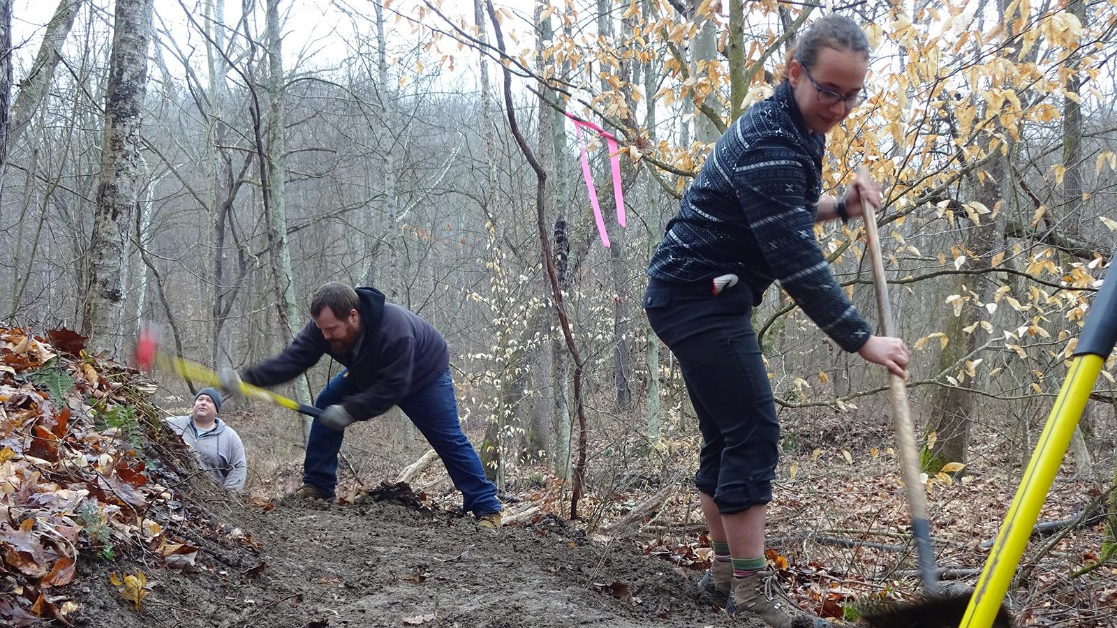 BTA workers George Blankenhorn and Charles Gordon work with OFS student Hannah Griswold on the Buckeye Trail. 